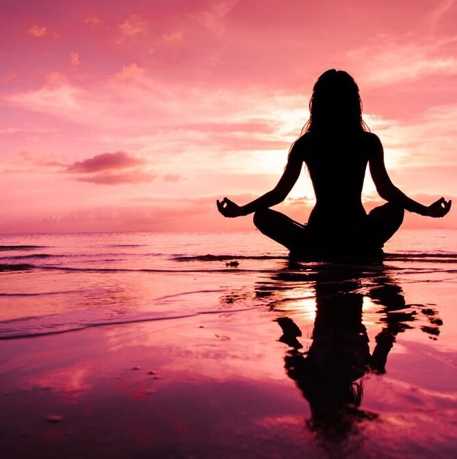 Insacre Holistic Shop - About Photo- This is a photo of a lady doing meditation.